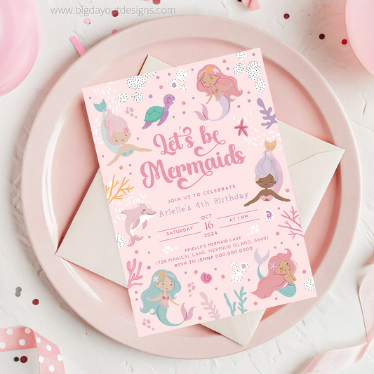 Mermaid-themed birthday invitation card on a pink plate with an envelope.