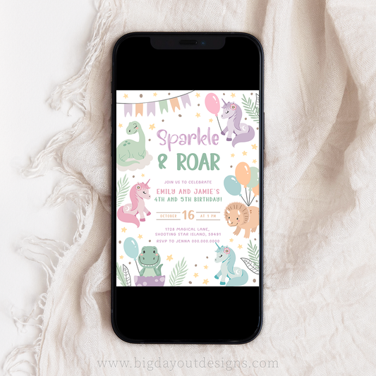 Phone displaying a birthday invitation with unicorns and dinosaurs and balloons on a white fabric background