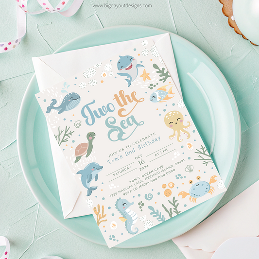 Children's birthday invitation with sea-themed illustrations on a light blue plate.