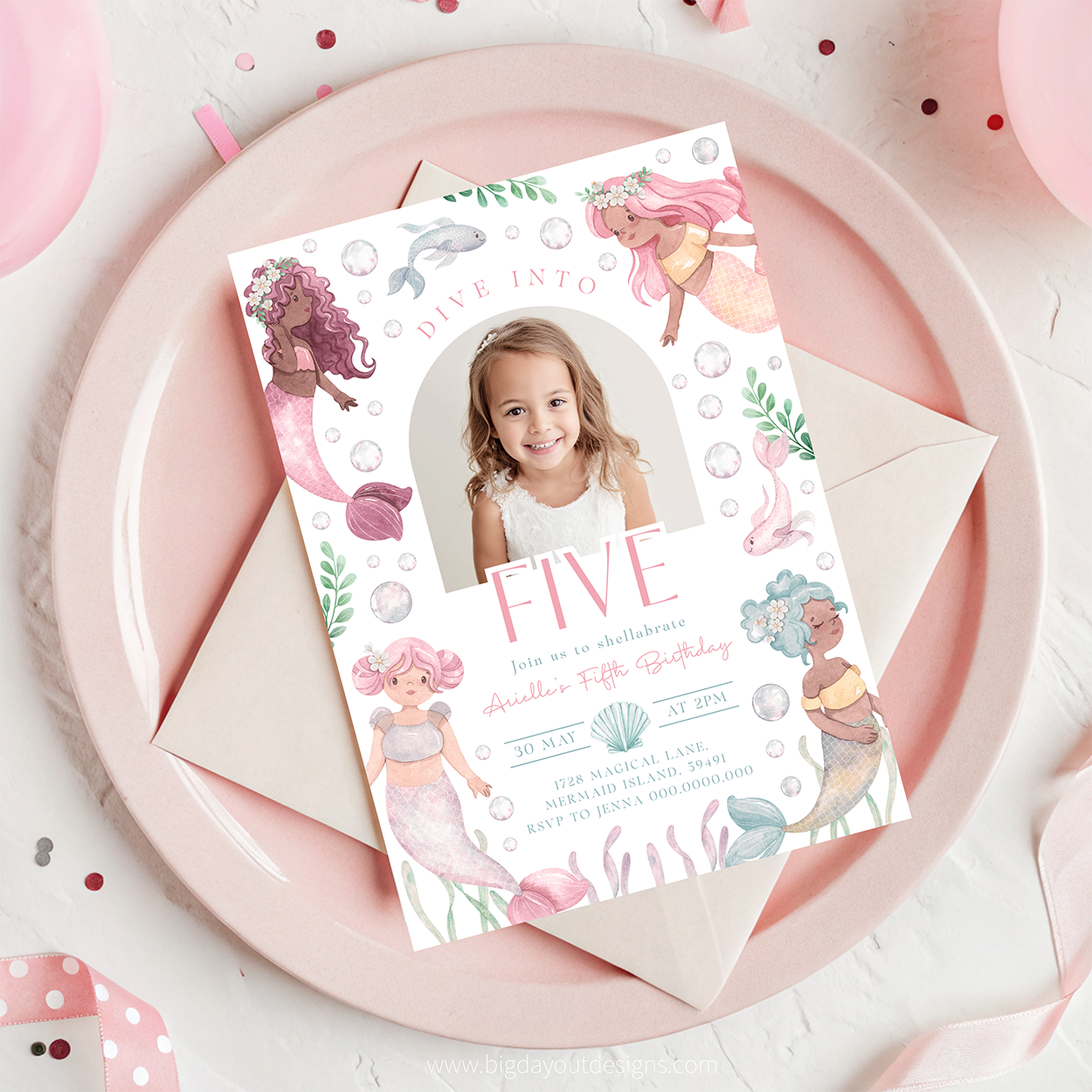 Birthday invitation card with mermaid design on a pink plate