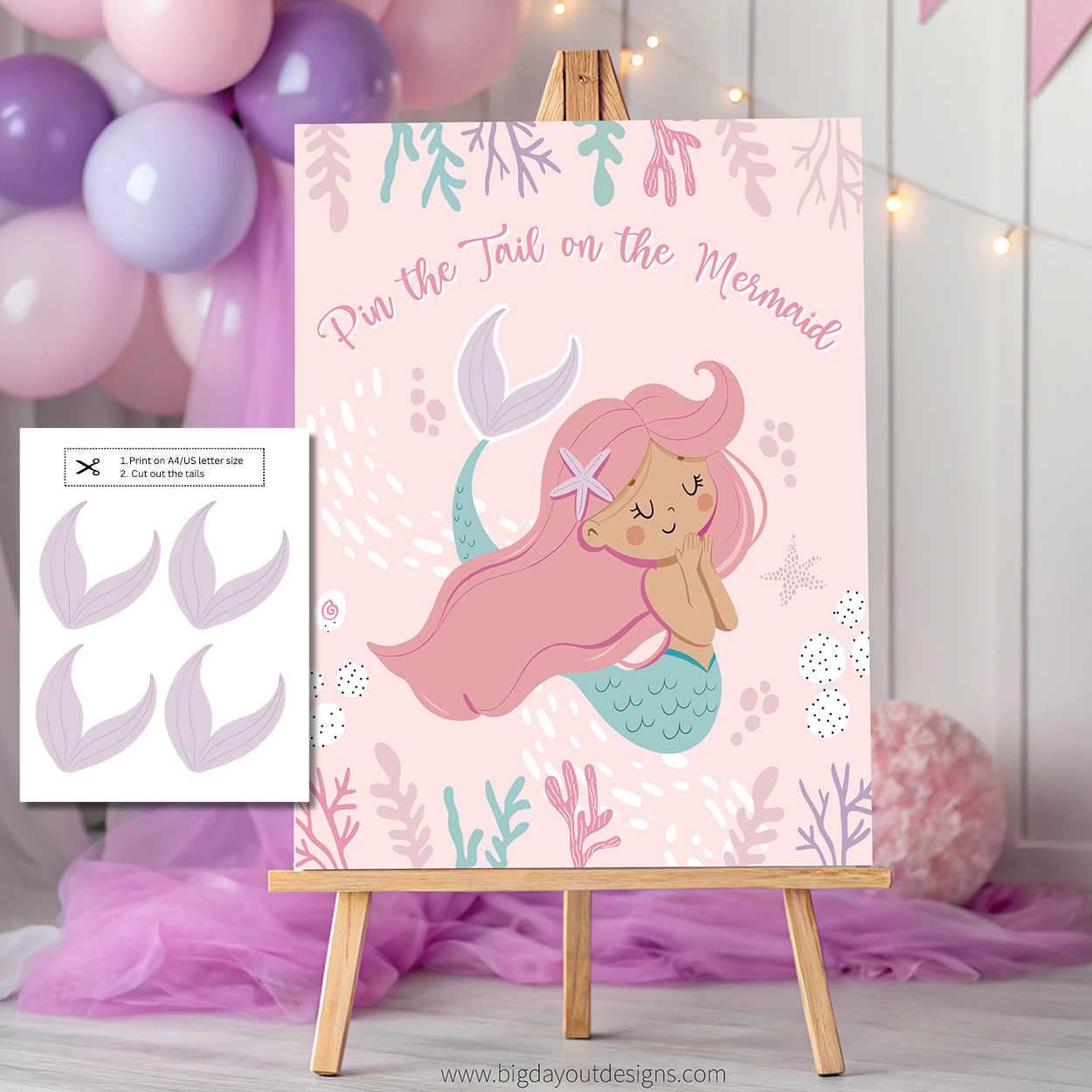 Mermaid-themed 'Pin the Tail on the Mermaid' game with balloons and tulle in the background.