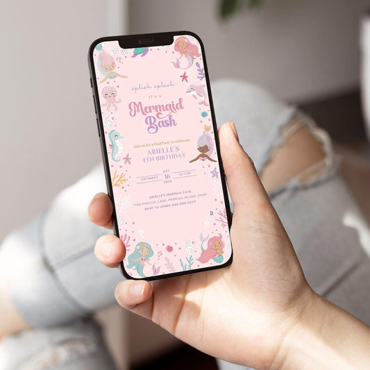 Hand holding a phone displaying a mermaid-themed birthday invitation.