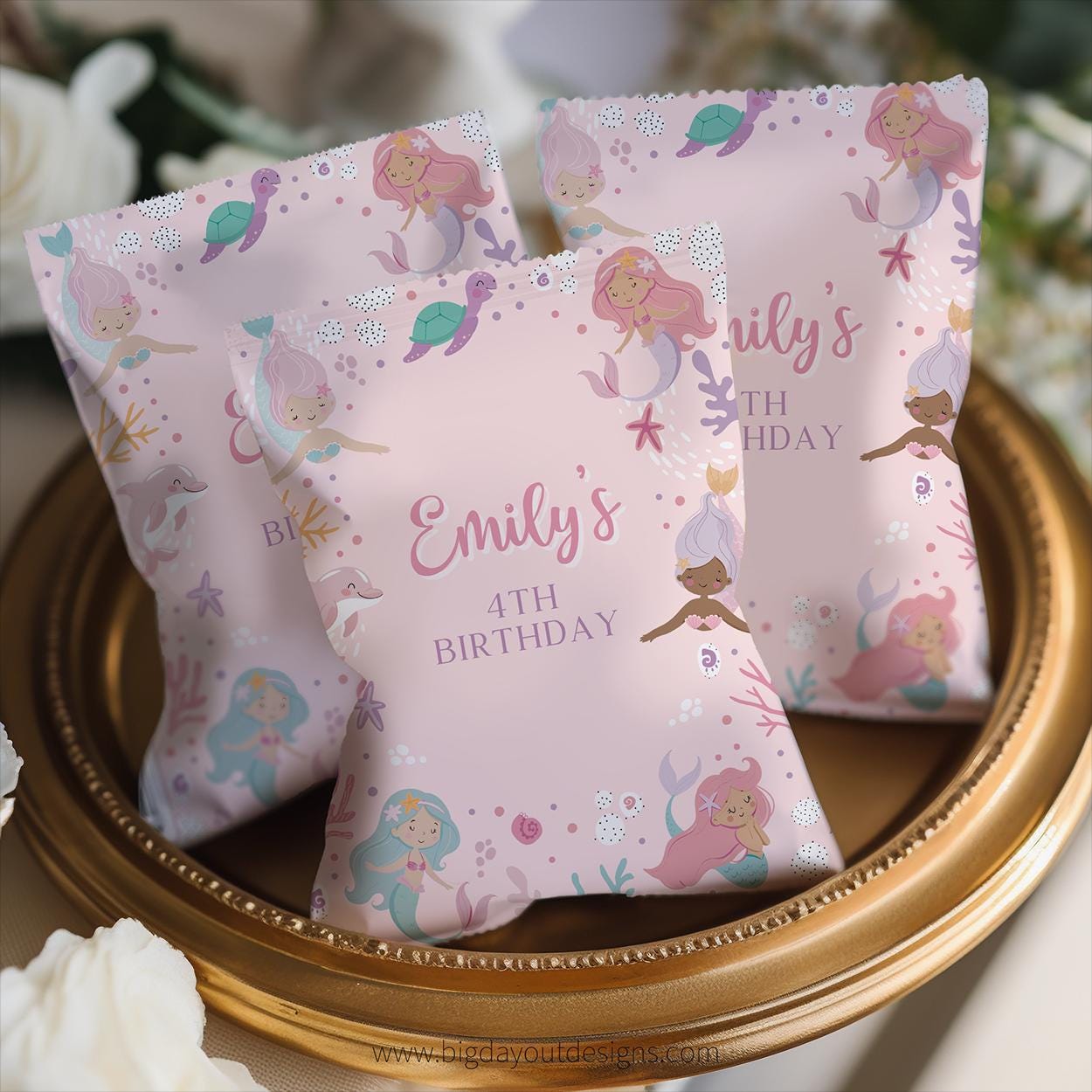 Personalized birthday pillow with mermaid design on a decorative stand.