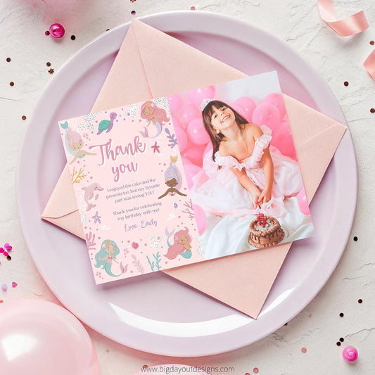 Pink birthday invitation with a photo of a girl in a white dress on a pink plate.