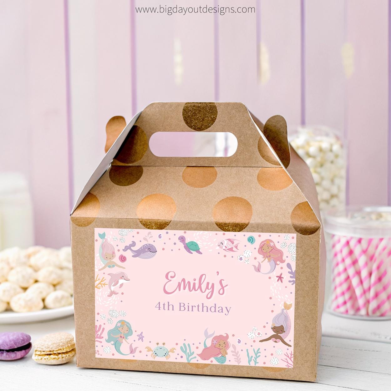Gift box with personalized mermaid design label for Emily's 4th birthday, against a light purple background.
