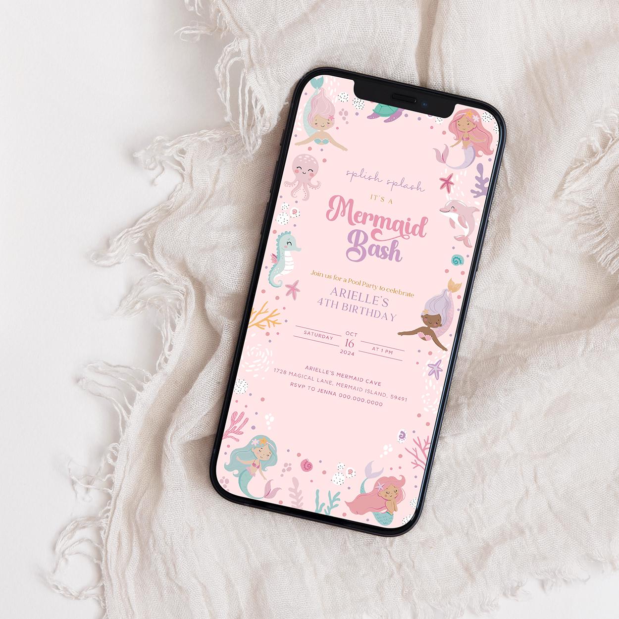 Phone displaying a mermaid-themed birthday invitation on a textured white surface