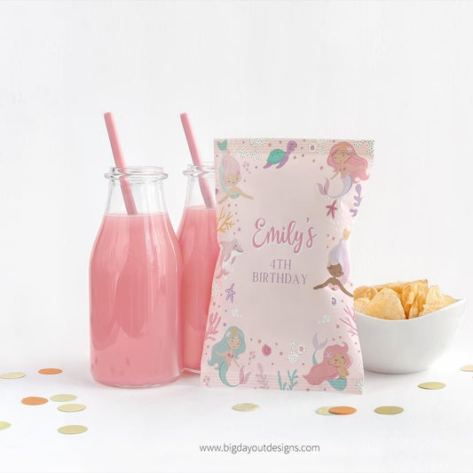 Pink milk bottles with straws and a personalized mermaid birthday bag on a white background.