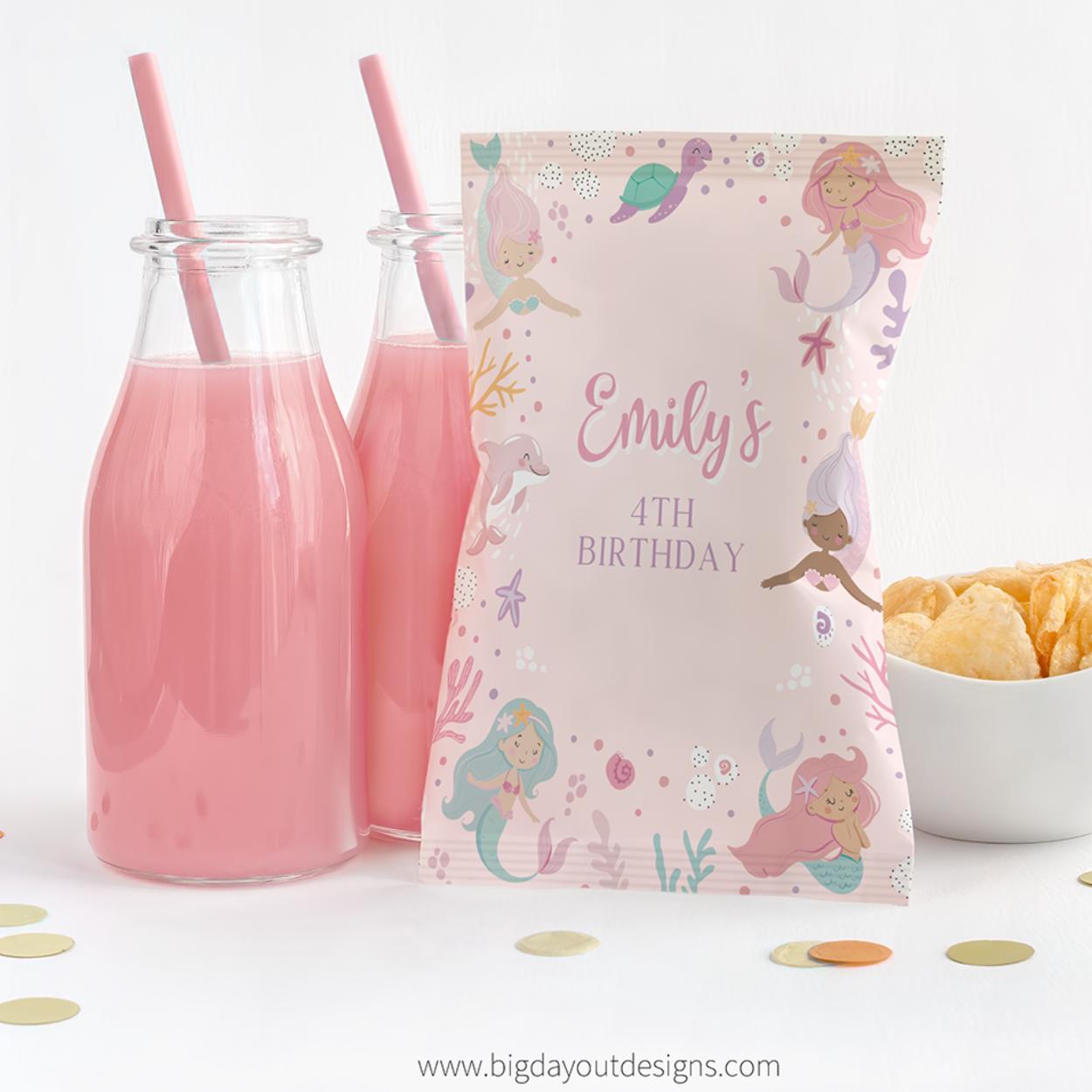 Personalized birthday bag with mermaid design next to pink bottles and snacks on a white background