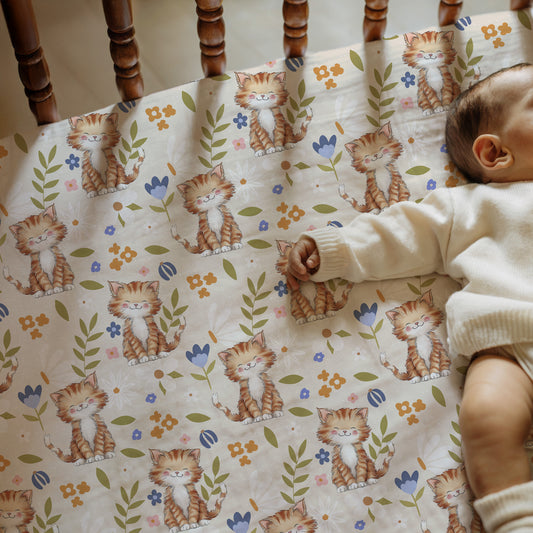 crib sheet with cat pattern
