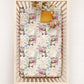 Crib with a floral sea otter patterned crib sheets