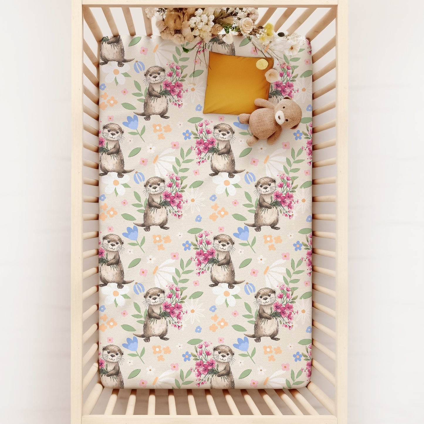 Crib with a floral sea otter patterned crib sheets