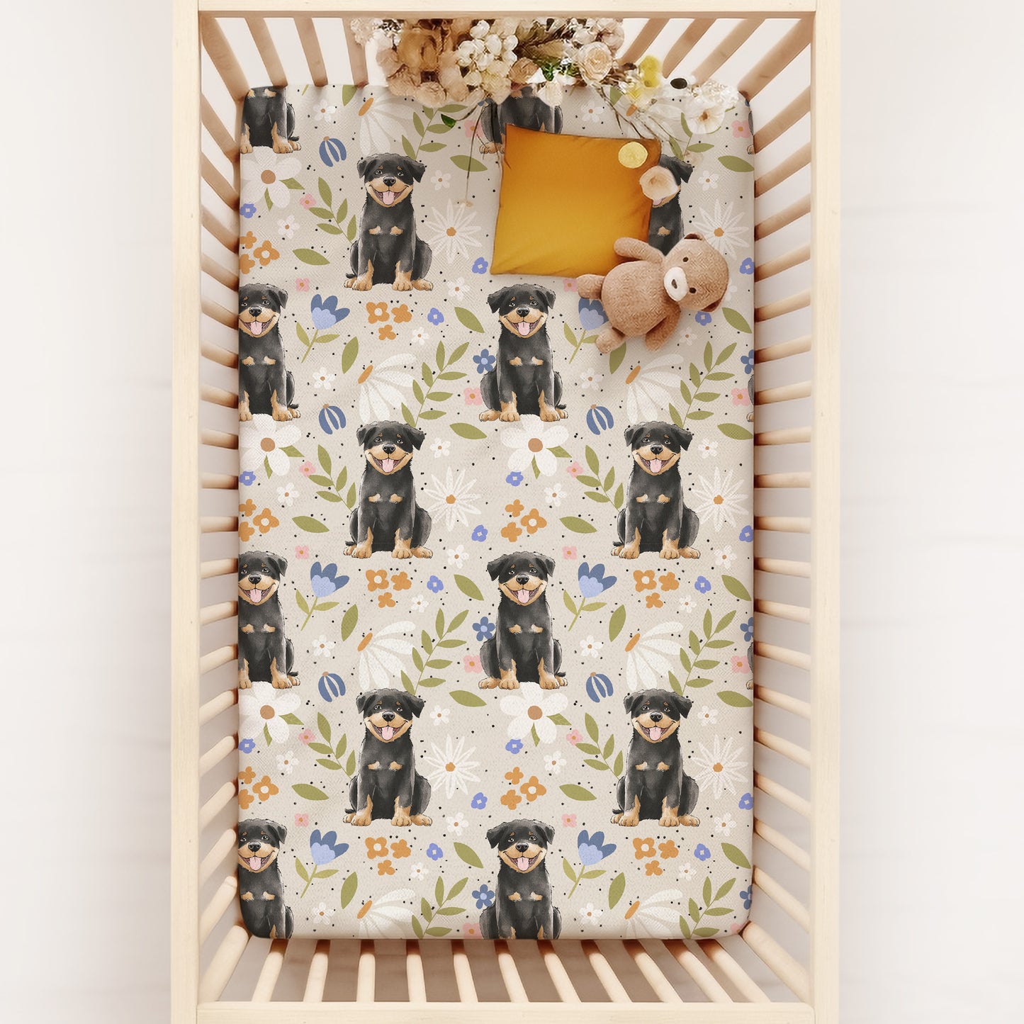 Crib with a floral Rottweiler Dog Patterned Crib Sheet