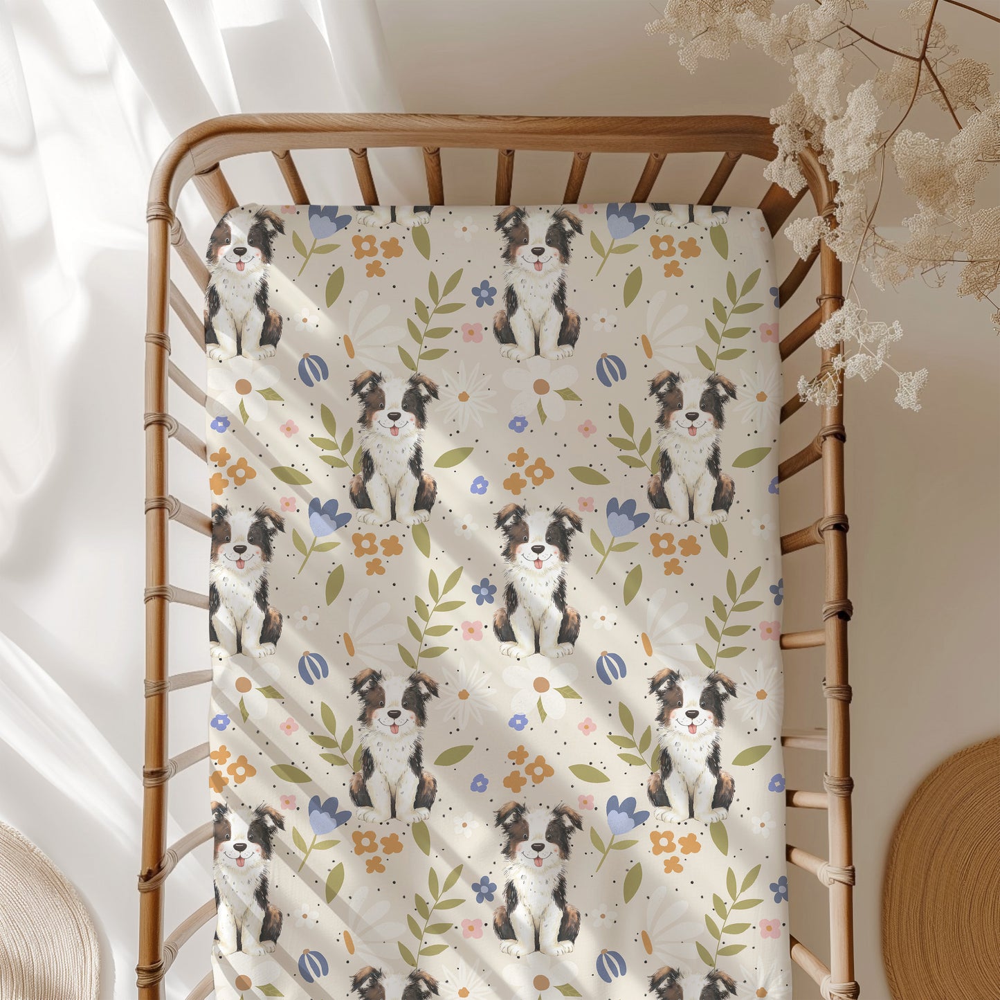 Blanket with dog pattern draped over a wooden crib in a softly lit room.
