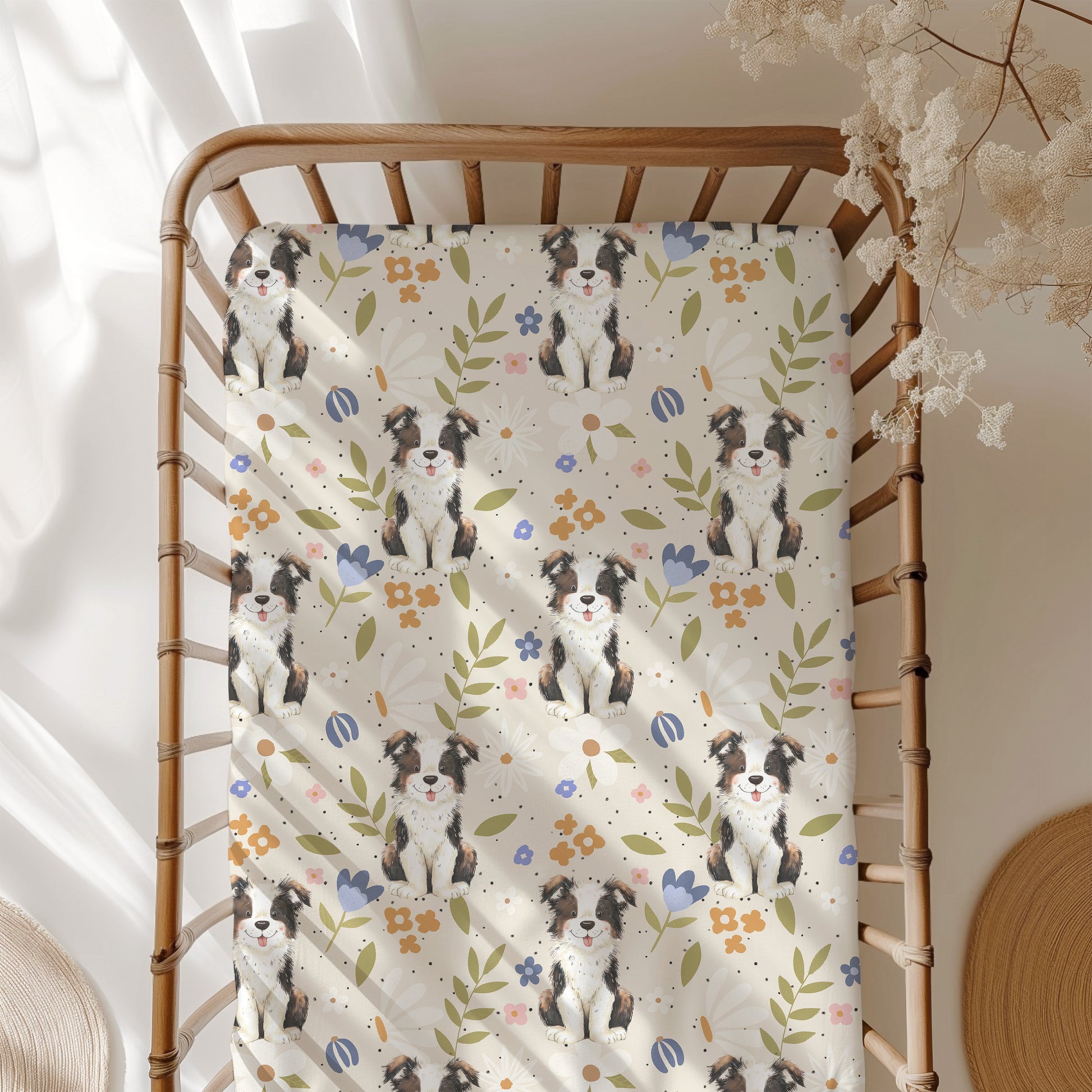 Blanket with dog pattern draped over a wooden crib in a softly lit room.