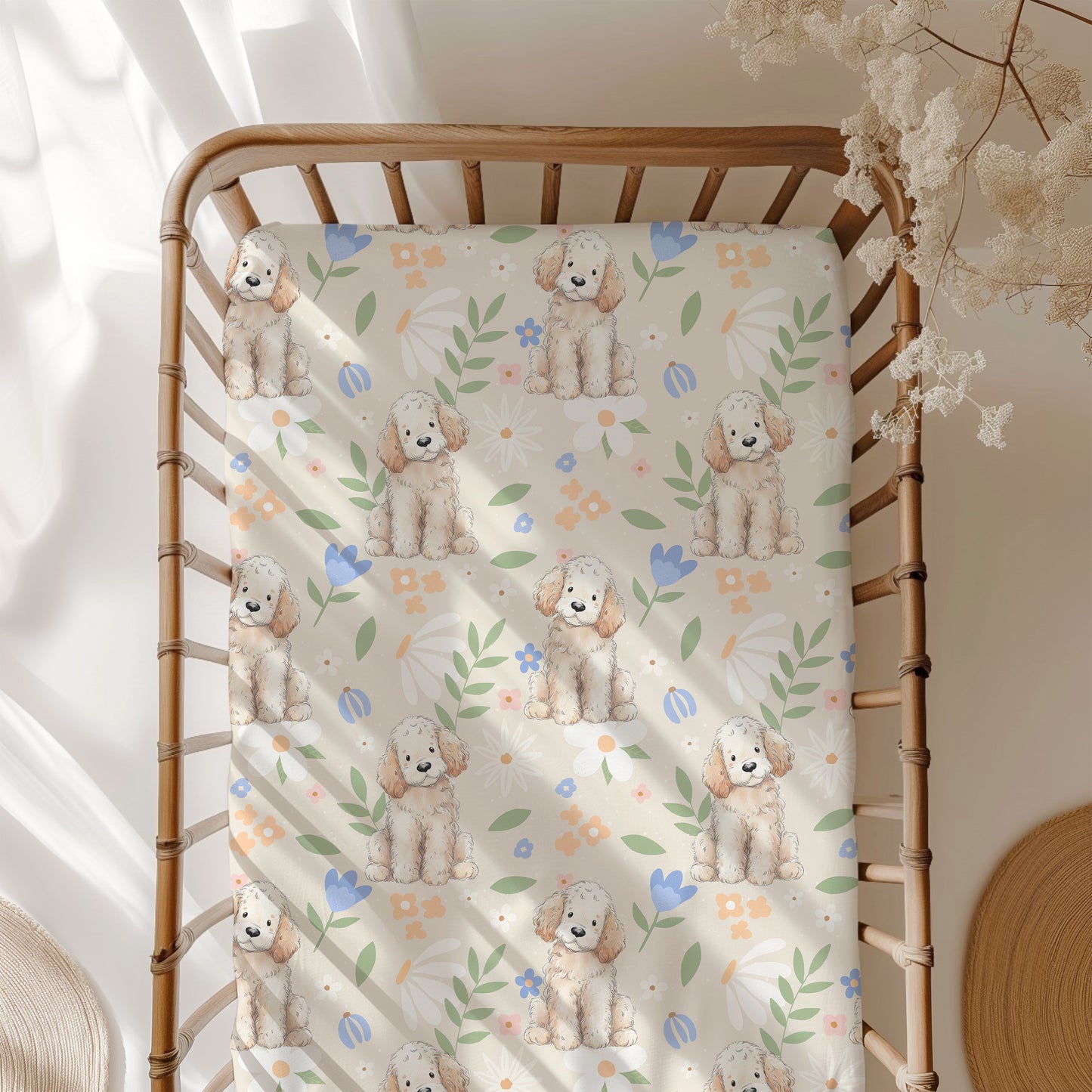 Crib with a floral-patterned sheet featuring dog illustrations