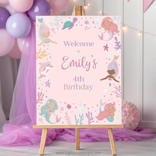 Birthday sign with mermaid design on an easel, surrounded by balloons and decorations.