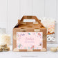 Gift box with a personalized mermaid-themed label on a white surface