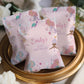 Personalized birthday pillow with mermaid design on a decorative stand.