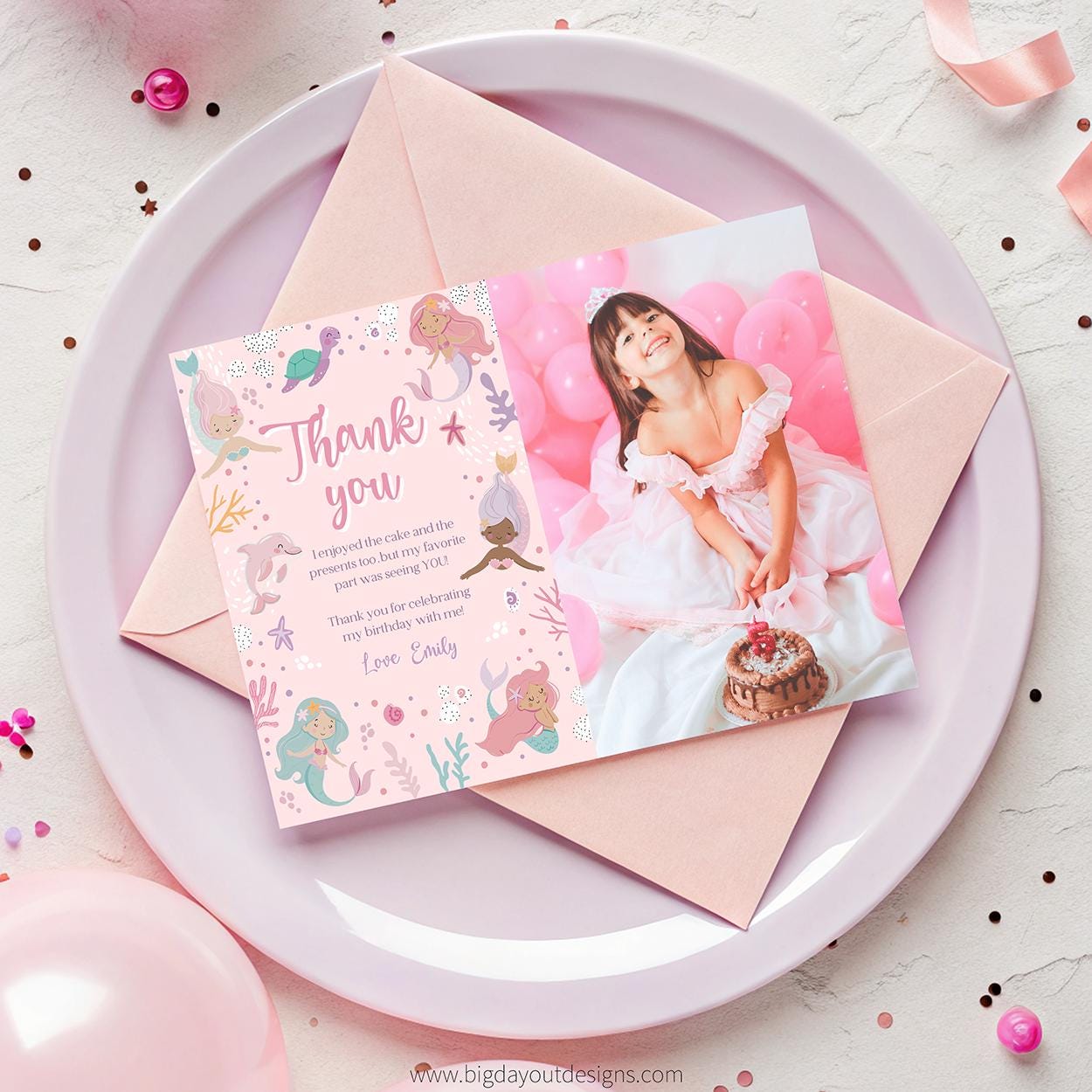 Pink birthday invitation with a photo of a girl in a white dress on a pink plate.