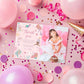 Thank you card with a photo of a girl in a white dress surrounded by pink balloons and confetti.