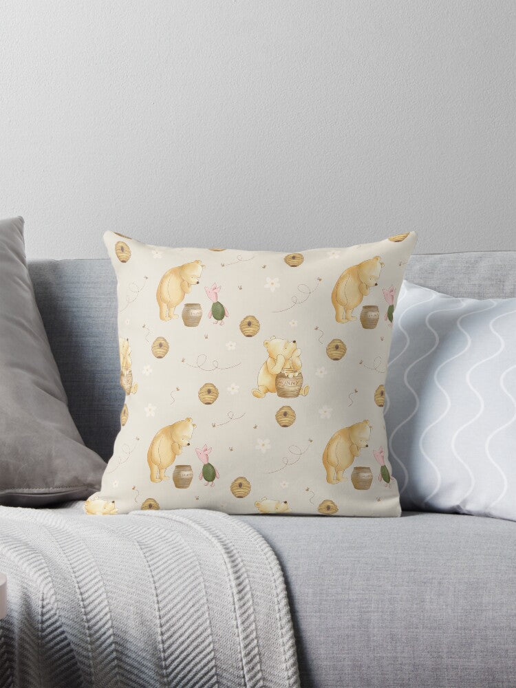 Decorative pillow with winnie the pooh pattern on a gray sofa
